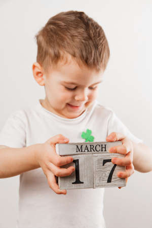 Little boy with Leprechaun hat on white background. St Patrick's Day.の写真素材