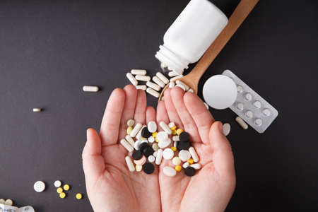 Pills in hand close up. Medicine concept