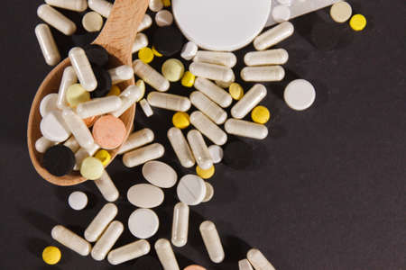 Pills close up on black background. Concept of medicalの写真素材