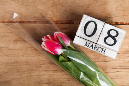 Women's day March 8 with wooden block calendar. Happy mother's day. Spring flower