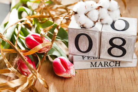 Women's day March 8 with wooden block calendar. Happy mother's day. Spring flower