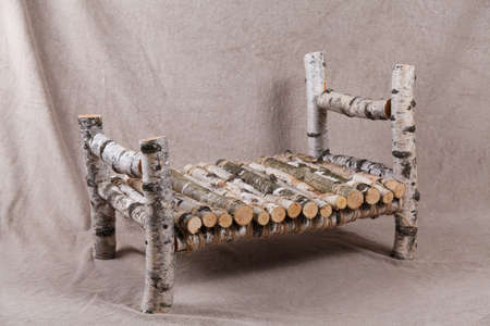 Wooden bed made of birch for newborn. Decor elementsの写真素材