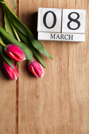 Women's day March 8 with wooden block calendar. Happy mother's day. Spring flowerの写真素材