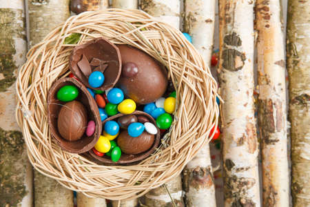 Chocolate eggs and color candy glaze. Background for Easter Day