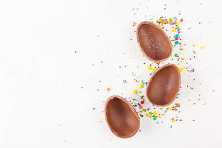 Chocolate eggs on blue background. Happy easter