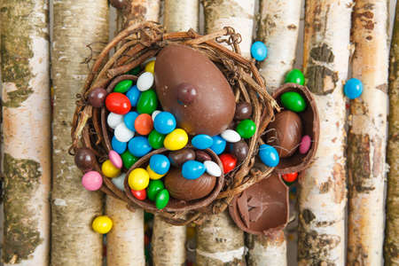 Chocolate eggs and color candy glaze. Background for Easter Day