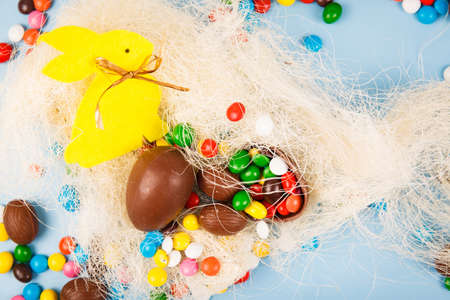 Chocolate eggs and color candy glaze. Background for Easter Dayの写真素材