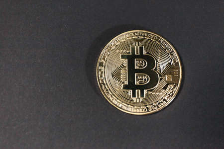 Bitcoin close up on black background. Concept of development of the crypto currencyの写真素材
