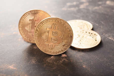 Bitcoin close up on black background. Concept of development of the crypto currencyの写真素材