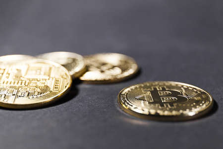 Bitcoin close up on black background. Concept of development of the crypto currencyの写真素材