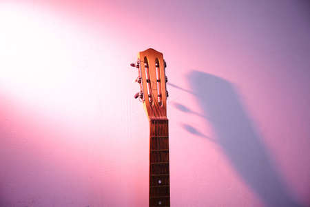 Old guitar in empty room. Concert hallの写真素材