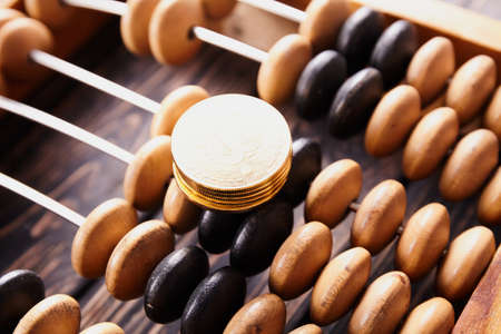 Vintage abacus on wooden background. Business concept