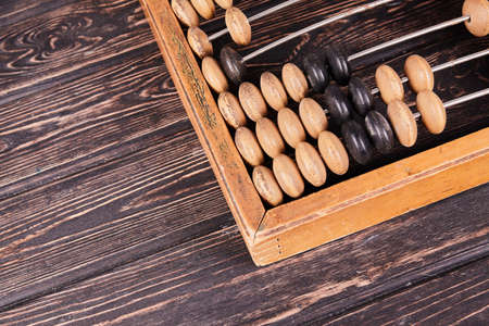 Vintage abacus on wooden background. Business conceptの写真素材