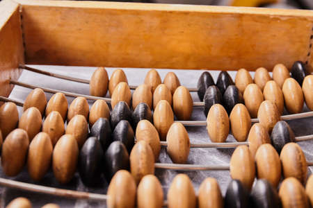 Vintage abacus on wooden background. Business conceptの写真素材