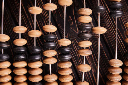 Vintage abacus on wooden background. Business conceptの写真素材