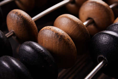 Vintage abacus on wooden background. Business concept
