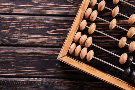 Vintage abacus on wooden background. Business conceptの写真素材