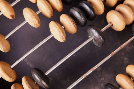 Vintage abacus on wooden background. Business conceptの写真素材