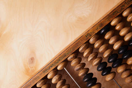 Vintage abacus on wooden background. Business concept