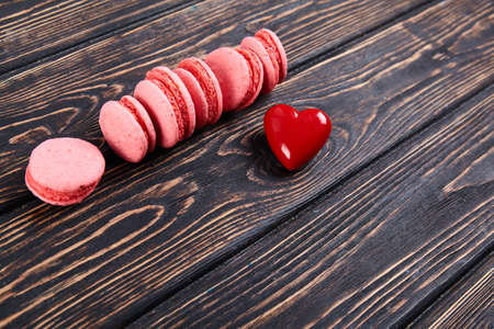 Fresh colored macaroons on wood desk. Food backgroundの写真素材