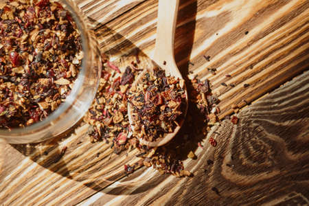 Dry tea in wood spoon. Food backgroundの写真素材