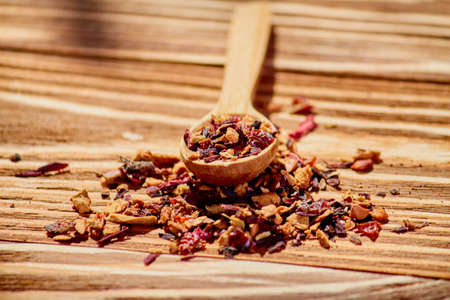 Dry tea in wood spoon. Food backgroundの写真素材