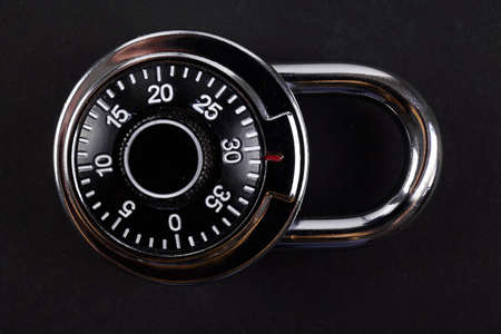 combination lock close up on black background. safe concept.の写真素材