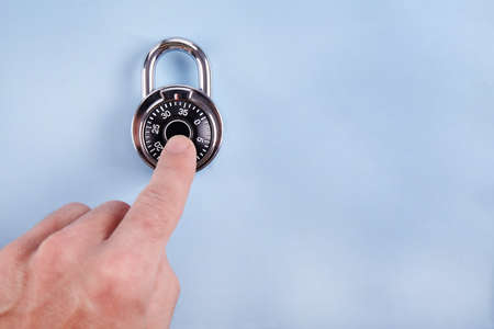 combination lock close up on black background. safe concept.
