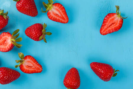 Ripe fresh strawberry on blue background. Fruits close upの写真素材