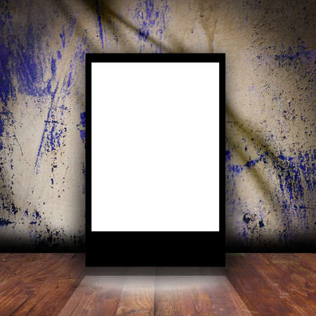 Advertising lightbox in empty room. Old grunge backgroundの写真素材