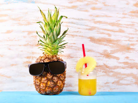 Ripe fresh pineapple in glasses. Travel conceptの写真素材