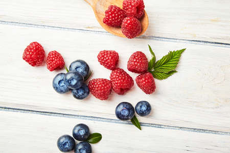 Ripe fresh raspberry and blueberry close up. Food ingredientsの写真素材