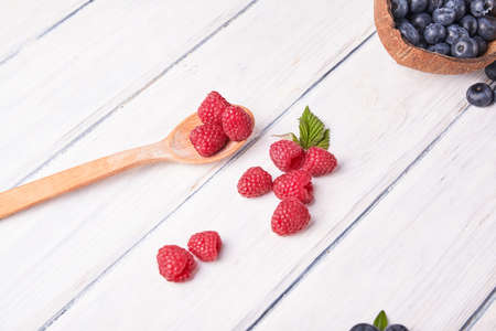 Ripe fresh raspberry and blueberry close up. Food ingredientsの写真素材