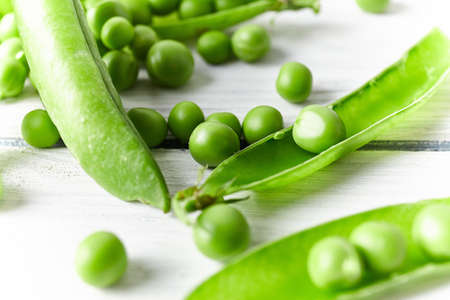 Fresh green peas close up. Food ingredients. Nature background