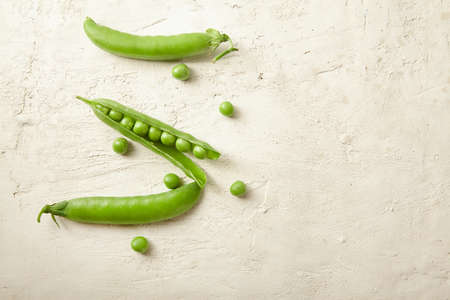 Fresh green peas close up. Food ingredients. Nature background