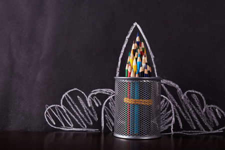 Rocket from pencil on black background with place for text. Back to school. Education concept