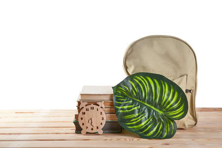 Backpack with supplies on wood desk with place for text. Education concept. Back to schoolの写真素材
