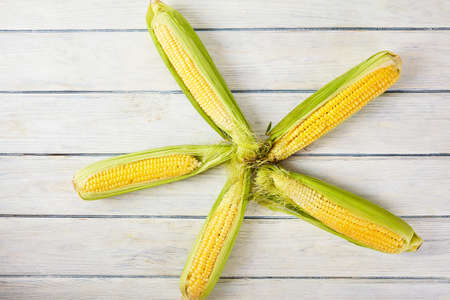 Fresh corn on wood desk. Food ingredients