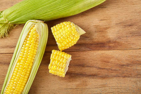 Fresh corn on wood desk. Food ingredients