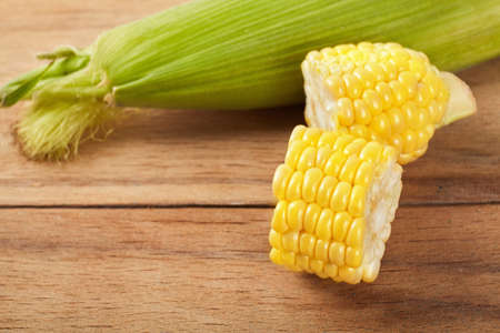 Fresh corn on wood desk. Food ingredients