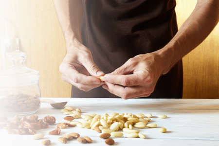 peeled almonds on the table. meal on wood
