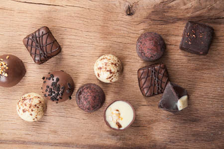 Chocolate candy on wood desk. Food ingredients