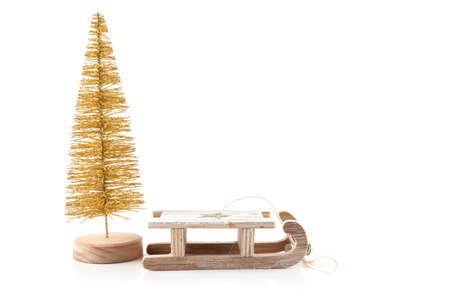 Gold christmas tree isolated on white with wood peopleの写真素材