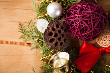 Christmas background with decorations and gift boxes on wooden boardの写真素材