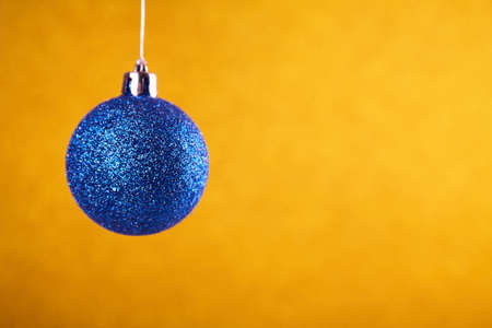 Christmas ball close up on blurred background. Happy new yearの写真素材