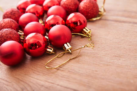 Red christmas ball on wood desk. Happy new yearの写真素材