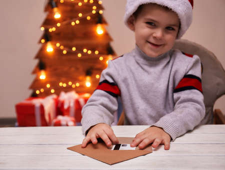 Little boy gets credit card from letter to Santa clausの写真素材