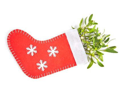 Broom from green mistletoe on wood desk. Nature background. Christmas plantの写真素材