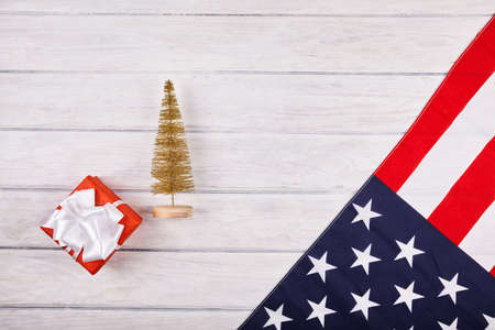American flag with christmas decorations on wood desk. Place for textの写真素材