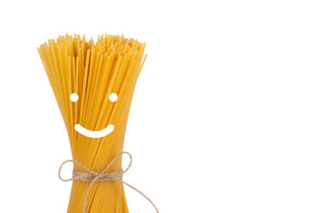 Bunch of spaghetti tied with rope isolated on white backgroundの写真素材